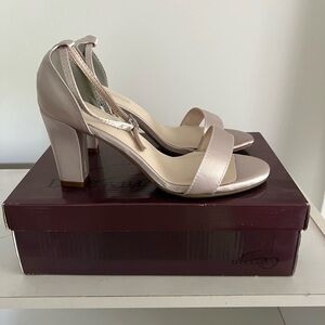 Never worn pair of dyeables heels. Size 8.